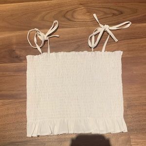 white ruffled tank top with adjustable tie straps